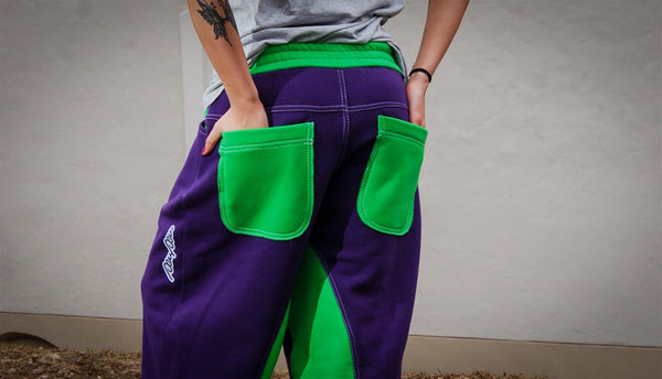 A pair of purple and green sweatpants with a comfortable, relaxed fit.